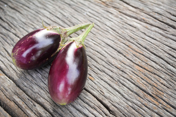 Group of eggplant on old wood background