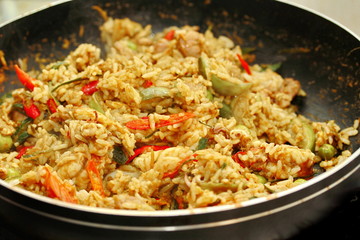 Cooking ,Fried jasmine rice in green curry with mixed meat.