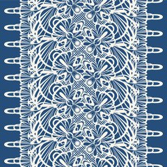Seamless pattern. Bright ornament lace braid on a blue background.