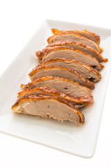 Grilled duck meat in white plate