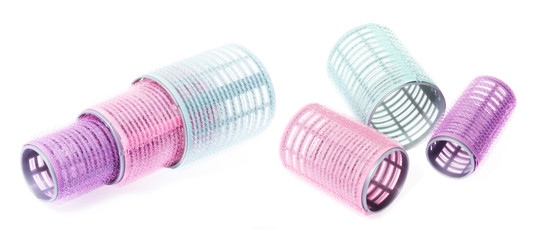 Colourful curlers composed on background