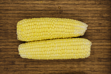 Corn on woodle background