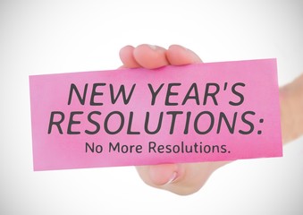 Hand holding a card with new year resolution goals