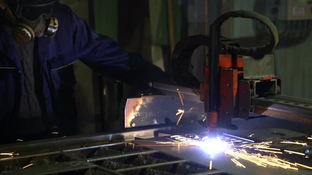 Cutting of metal. Sparks fly from plasma and metal interaction