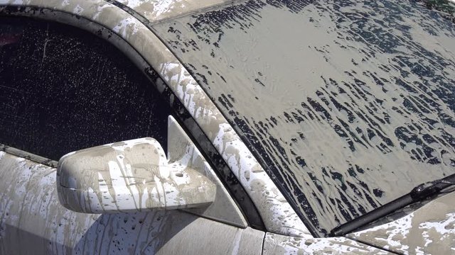 the Windshield of the Car in the Mud