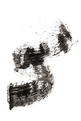 Stroke (sample) of black mascara on background
