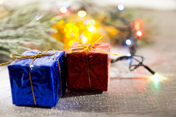 brightly colored gift boxes on wooden background, top view, new year and Christmas. Bright shade gift