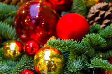 blurred fuzzy red balls and stars, gift wrapping decorations on a Christmas tree as a background and substrate