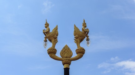 Fototapeta na wymiar Angel statue holding a lamp
