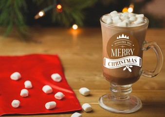 Merry Christmas greetings with coffee and marshmallow in glass