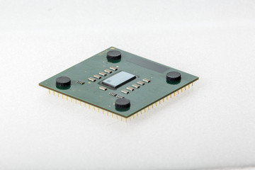 CPU. Modern computer processor unit. The microprocessor is located on a green PCB. 4 mounting pads on the card and microelements around the processor chip. Isolated on white background.