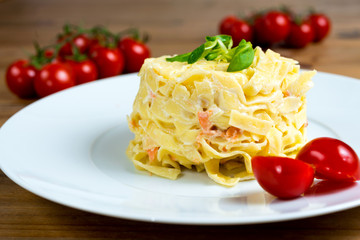tasty pasta with salmon on a the table