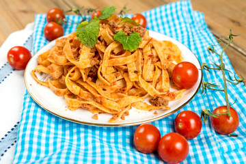tasty Tagliatelle - Italian meat sauce pasta on the table