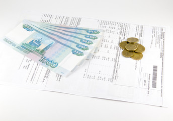 Receipt for utilities and russian money rubles on a white background