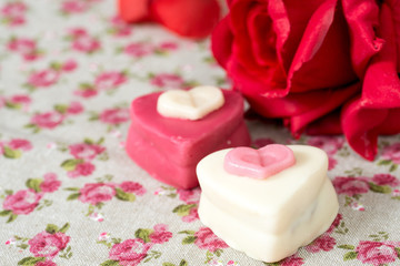 Small heart-shaped chocolates with white background, ideal for y