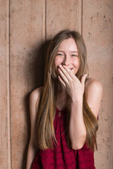 Beautiful giggling teen girl in Red top
