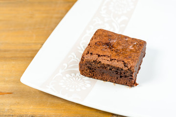 Chocolate Brownie cake on a dark plate