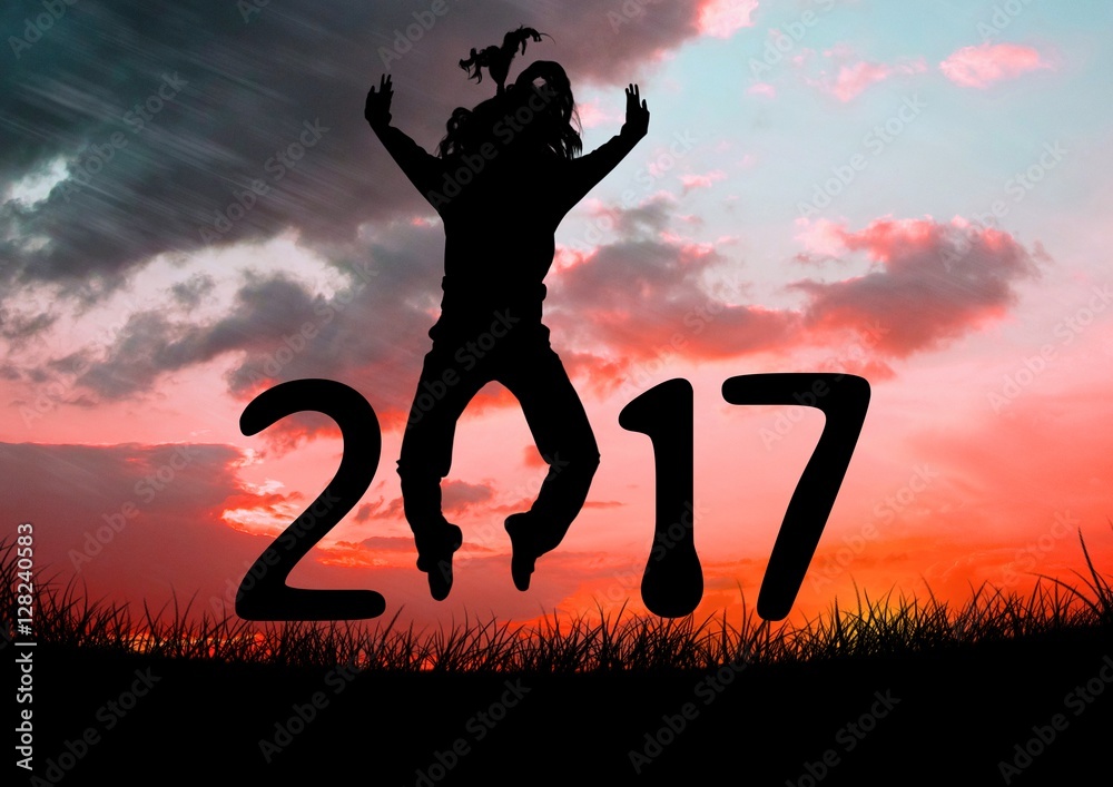 Wall mural Silhouette of a jumping person forming 2017 new year sign