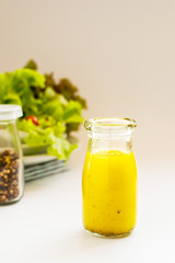 basic salad dressing made with olive oil lemon juice honey salt and black peppers.
