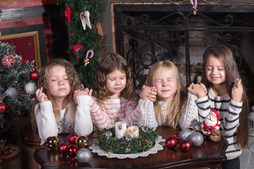 girls makes a wish at Christmas