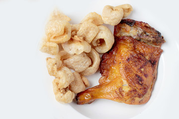 Streaky pork with crispy crackling and Grilled chicken leg ioslated on white background close-up. horizontal view from above. Thai Food