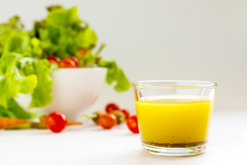 basic salad dressing made with olive oil lemon juice honey salt and black peppers.

