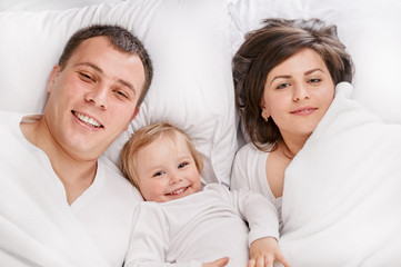 portrait family together in the bed