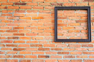  picture frame on brick wall.