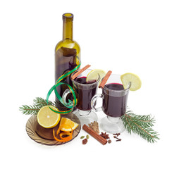 Two mugs with mulled wine, wine, mulling spices, fir branches