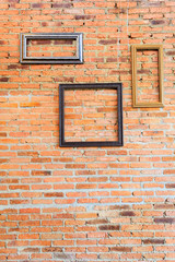 picture frame on brick wall.