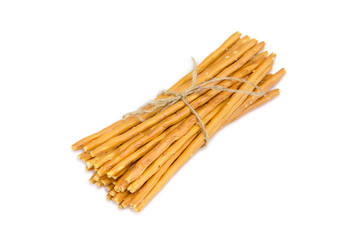 Bundle of salty pretzel rods on a light background