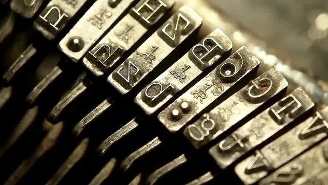 Typing with old typewriting machine, vintage device