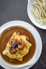 francesinha traditional meat cheese spicy sauce grilled sandwich