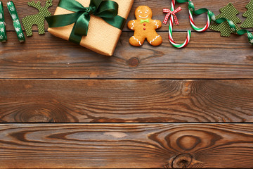 Christmas present and decoration on wooden background