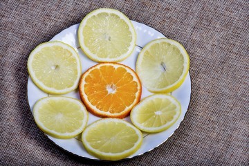Fototapeta na wymiar Vintage photo, Slices of lemon and orange lying on old rustic wooden background