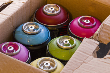 box with spray cans