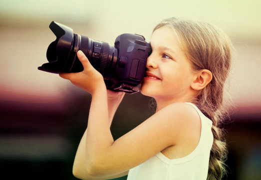girl  holding photo camera