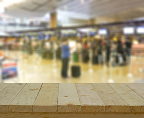 Obraz premium wood table top on blur background of counter checkin at airport - can use to display or montage on product