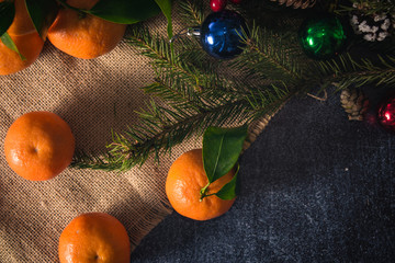 Fototapeta na wymiar Christmas decorations and fresh clementines