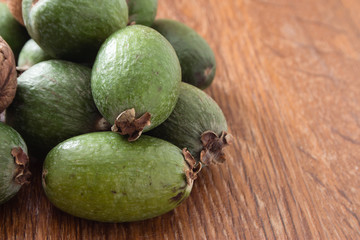 Feijoa fruit on wooden background