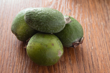 Feijoa fruit on wooden background