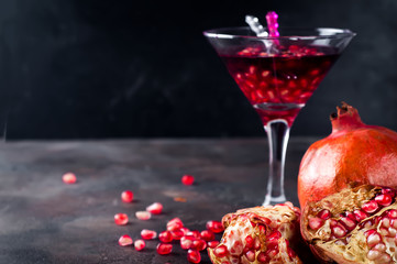 pomegranate cocktail and ripe red pomegranate fruit
