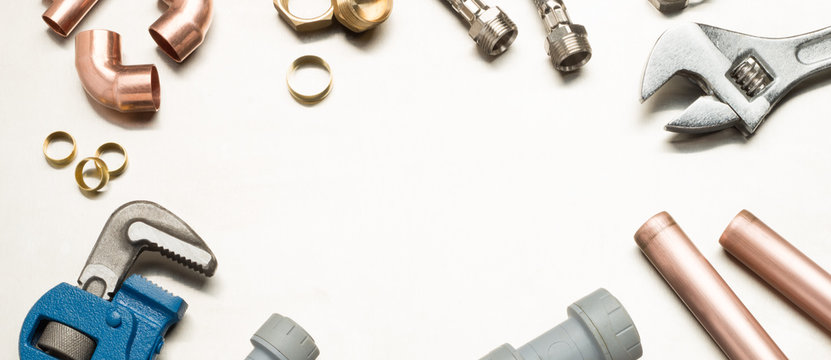 Plumbers Tools and Plumbing Materials Banner with Copy Space