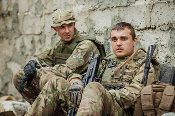 Portrait soldier or private military contractor holding sniper ranger