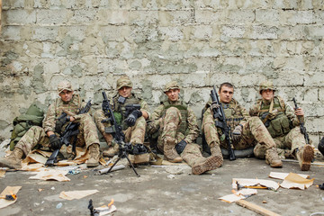 Fototapeta premium british rangers sitting and looking at the camera