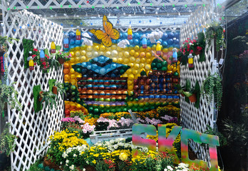 Small pocket garden made from mix of recycle material and flower at Floria Garden, Putrajaya,...