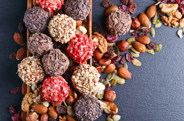 Homemade candy with chocolate , nuts and dried strawberry