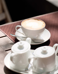 Cup of cappuccino in outdoor cafe
