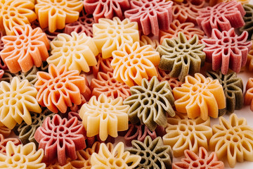 Colored dry italian pasta background.