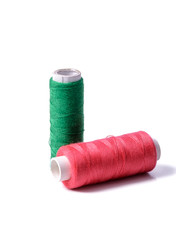 Colorful bobbin thread on white background